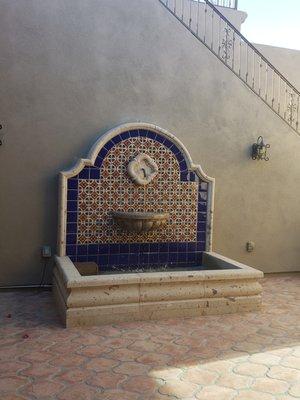 Courtyard garden fountain, previously just a blank wall. They also plumbed it with an auto fill.