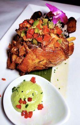 Pernil Braised Pork Shank dressed w/ Argentinian Chimichurri Rice & Beans /Sweet Plantains /Guasacaca Sauce