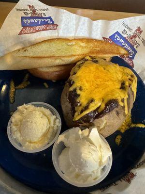 Loaded potato w/pork brisket...added butter & sour cream & delicious buttered toast...