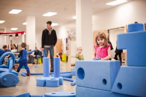 Blue blocks build motor skills as well as facilitate social interaction.