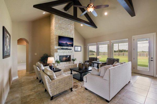 Living room that's open to kitchen and dining.