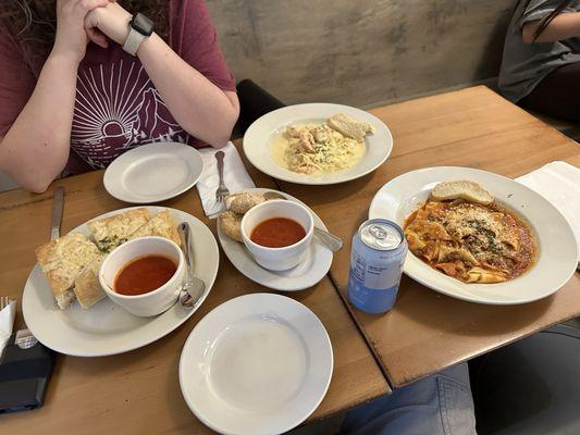 From left to right clockwise. Focaccia, fried mozzarella, fettuccine alfredo w/shrimp, and pappardelle bolognese.