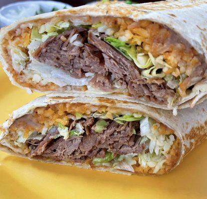 1 lb Burrito filled with rice, beans, cheese, lettuce, sour cream and your choice of meat.!