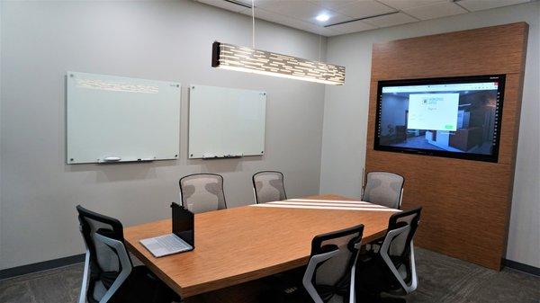 State of the art conference room with touch screen board and white boards.