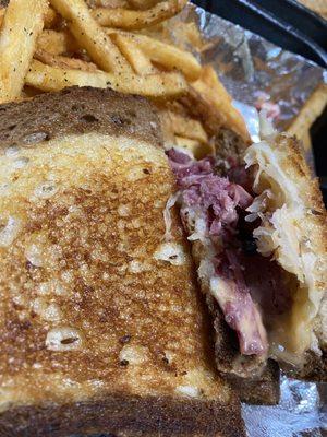 Rueben Sandwich with seasoned fries