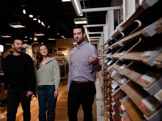 Sergenian's employee showcasing large variety of flooring options.