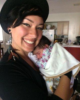 Holding a strong and healthy baby at our first postpartum visit