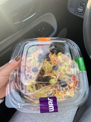 Salad was put into a lid and tapped with 4 stickers with another lid on top