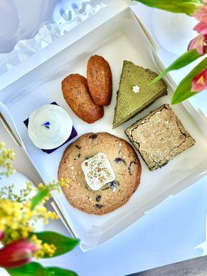 Paradise Bake Box with a Torched S'more Cookie, Black Sesame Brownie, Matcha Gateau Au Chocolat, Ube Pound Cake, and Earl Grey Madeleine