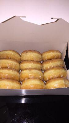 A dozen glazed donuts