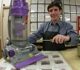 Andy repairing a vacuum.