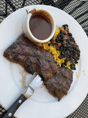 Churrasco steak with rice and beans and red wine mole sauce