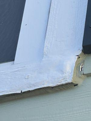 Original rot and now paint on the main house and the top board vertical is cut in half and 2 different woods/textures.