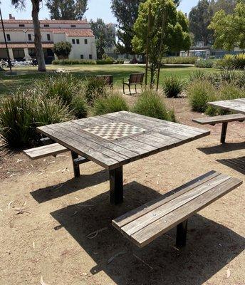 Three wooden chess tables.