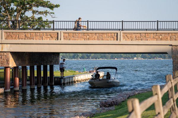 Boat going through the channel on Fairmont's Chain of Lakes