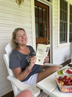 Relaxing on porch checking out the menu of wines!