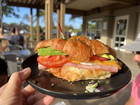 Egg sandwich. Croissant with egg, cheese, avocado, tomato. Delicious, especially with Tabasco sauce.