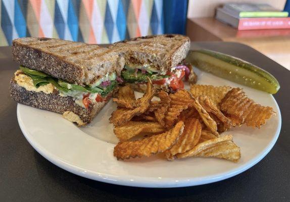 The Vegitteranean -- a delicious vegetarian sammy layered with house-made hummus & sun-dried tomato pesto, and lots and lots of veggies.