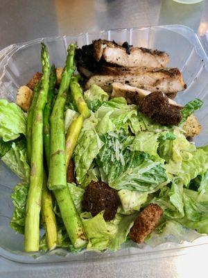 Grilled chicken with two sides of chopped salad and grilled asparagus