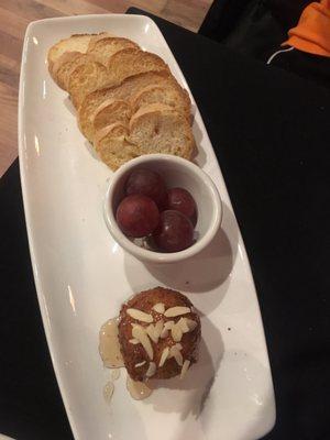 Fried goat cheese with a honey glaze and grapes.