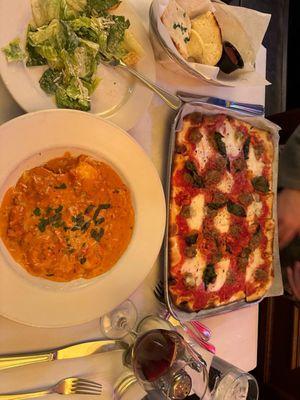 Lobster ravioli, garlic bread, Caesar salad, pizza