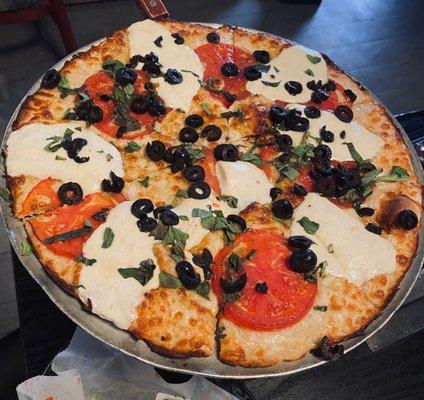 The Lombardi's Margarita. Fresh Mozzarella, Basil, Fresh Tomato and Black Olives. No sauce.