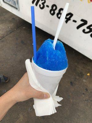 Blue coconut with a scoop of ice cream mixed in