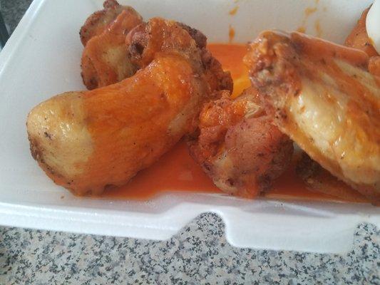 White chicken wings, no one is daring enough to eat them, no idea what the orange sauce is that stinks.