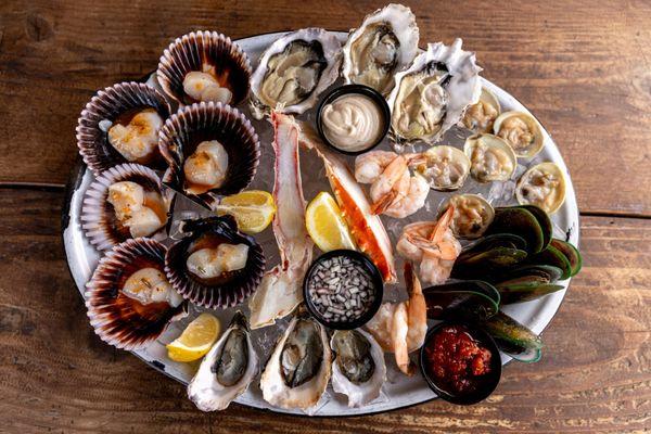 Our Fresh Seafood Platter is perfect for sharing. Especially when paired with a glass of California wine.