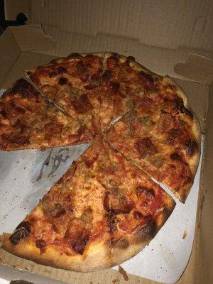 Small cold dry cheese, sausage and bacon pizza