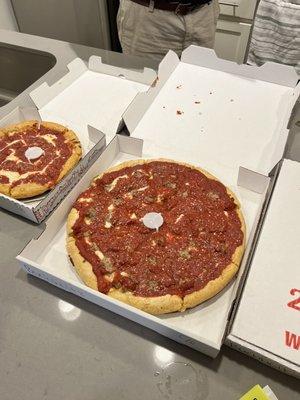 Large deep dish with sausage and small cheese pizza