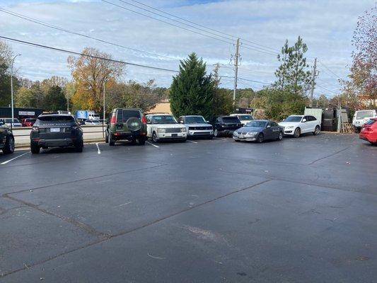 Only Range Rover, Land Rover, and BMW in the parking lot