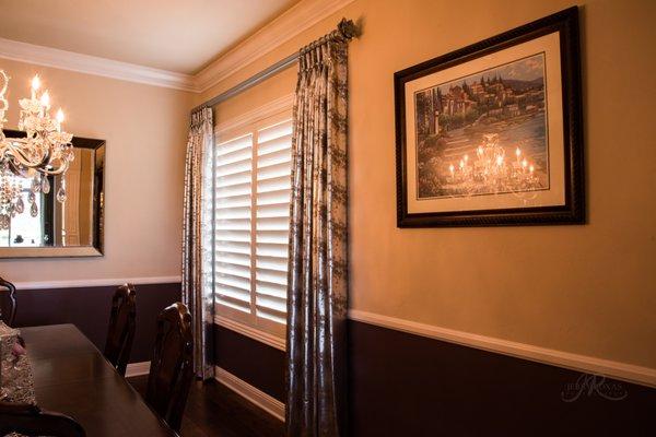 Pretty linen drapes  with a slightly metallic pattern add contemporary twist to this dining room.