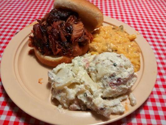 Pulled rib sandwich, w potato salad and cheesy corn