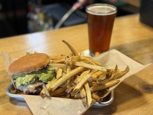 Guac burger with a pint