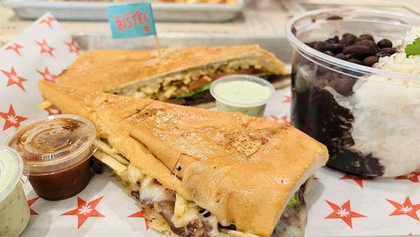 Pan con bistec with black beans and white rice