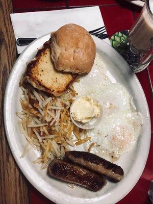 Sausage, eggs, hash browns, and biscuit.