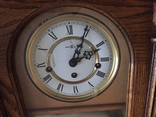 There are glass pieces inside the dial of the Grandfather Clock due to the damage caused by the carelessness of Hollywood Moving & Storage.