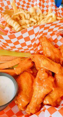 Buffalo wings and a basket of fries