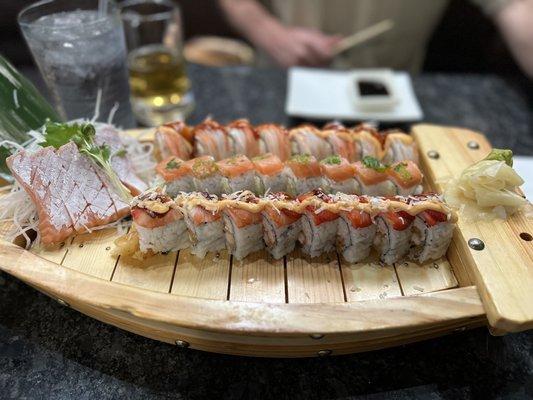 Left is salmon belly sashimi. Top is sunshine roll, middle is new Philadelphia roll and bottom is the strawberry fields roll.