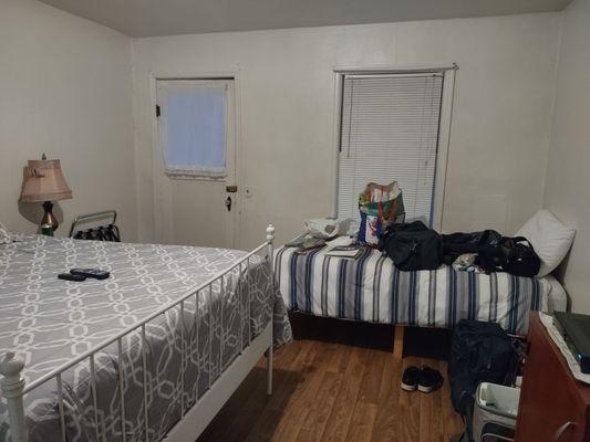 The apartment bedroom, has a dresser