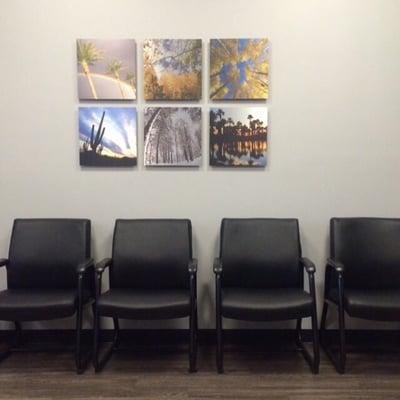 Dr. Terri Barbee's waiting room with complimentary water, chairs, a sofa, tv and a kid's play area.