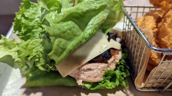 Build your own chicken breast lettuce wrap with grilled mushrooms and swiss.