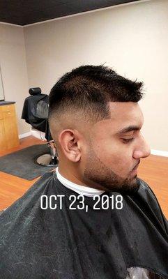 Mid to high fade with beard line up