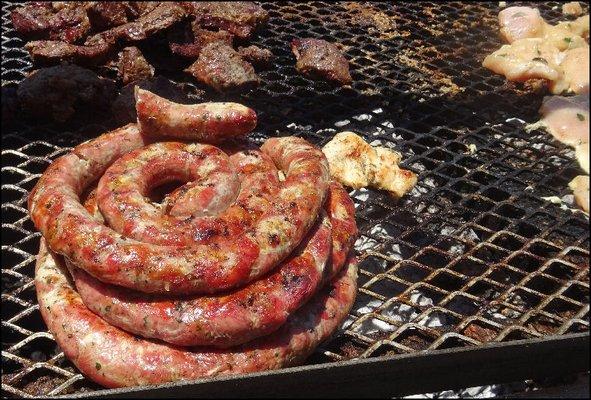 Sausage cooking on the grill, along with sirloin steak and chicken.  How did I choose?  I simply didn't... as it was simply sausage.