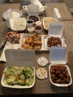 Family Pack: veggies, orange chicken, teriyaki chicken, teriyaki beef, rice, noodles, sauces, egg rolls and fried shrimp