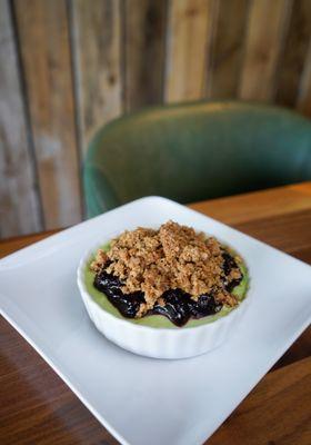 pistachio custard with blueberry sauce and oat streussel