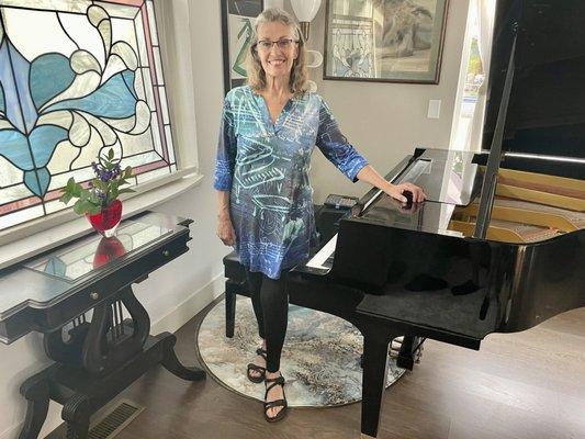 Jan, at her piano in her home studio