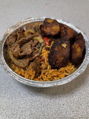 Steak, peppers, onions, rice & beans, plantains.