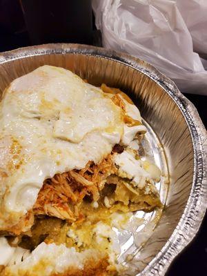 Chilaquiles con huevos - added chicken, no onions. It was great! Huge portion. Lots of flavor and chicken.